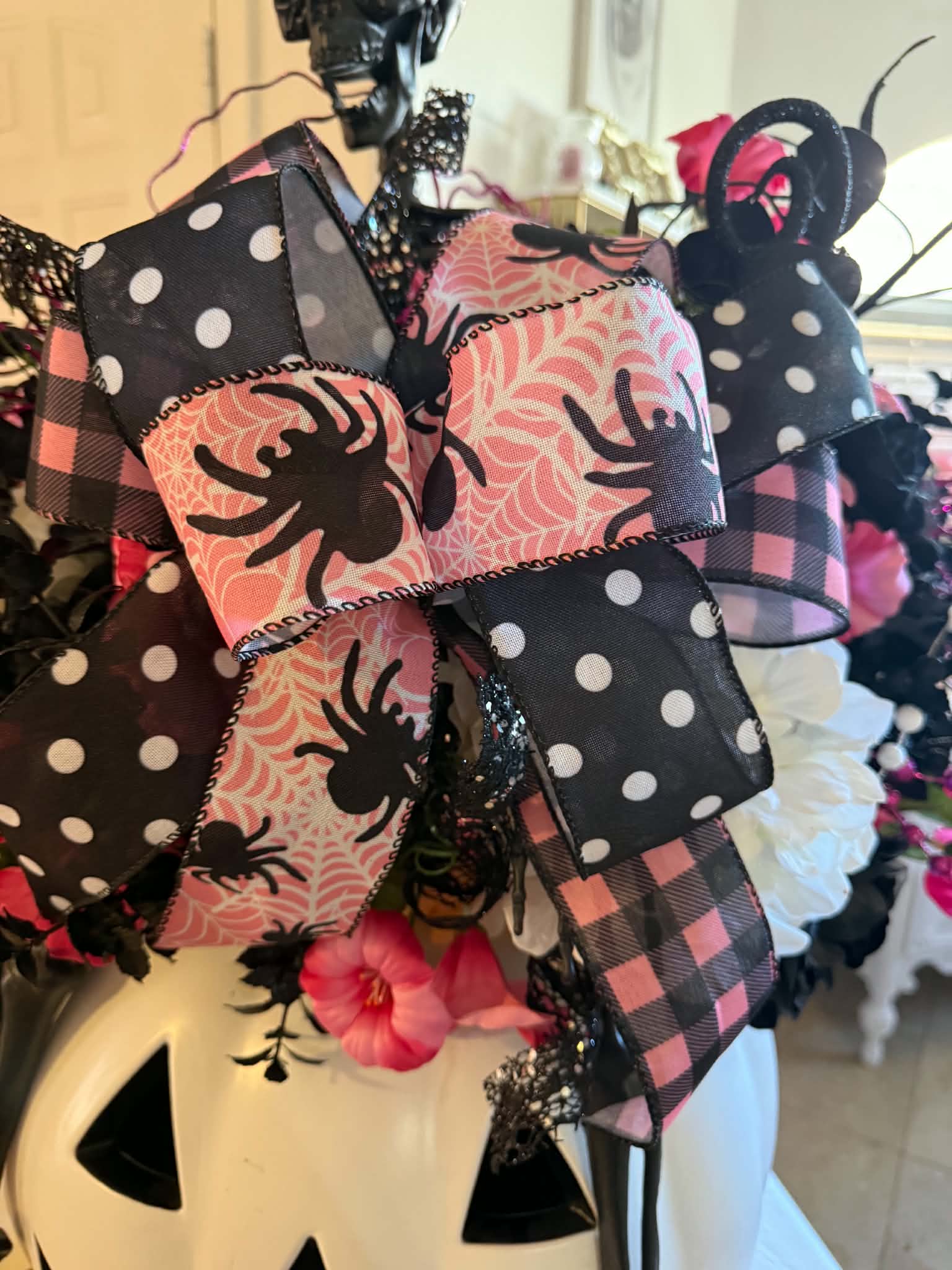 Close-up of skeleton and ribbon bow detail