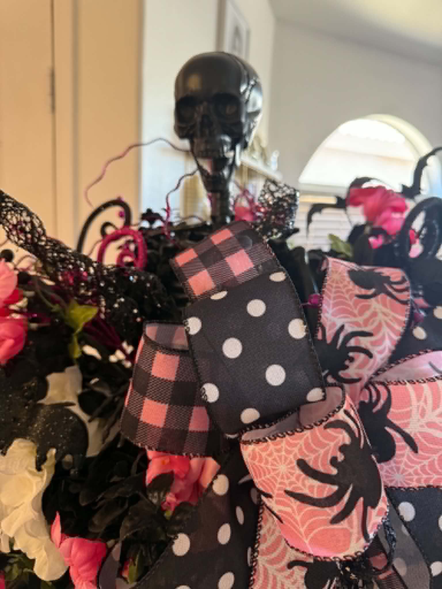 Close-up of pink florals and black foliage