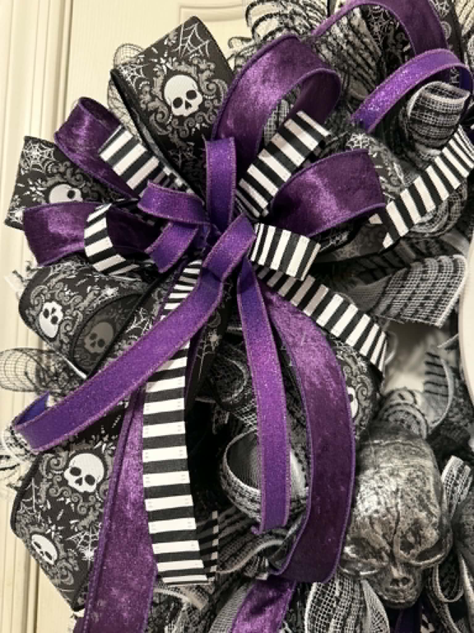 Purple and black striped ribbon bow detail