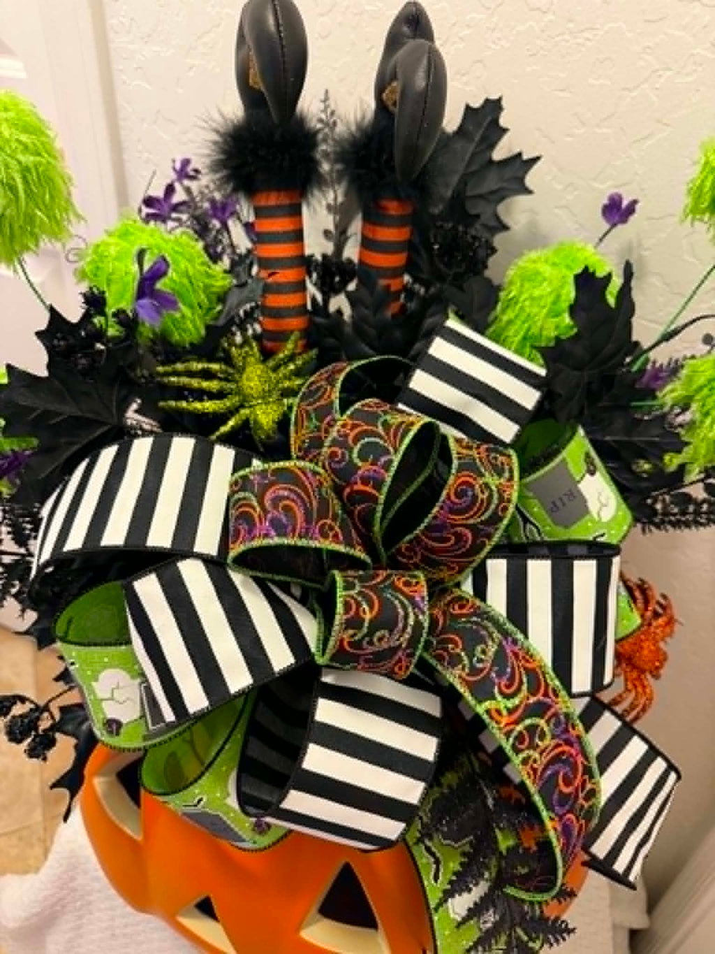 Halloween witch legs pumpkin centerpiece bow detail