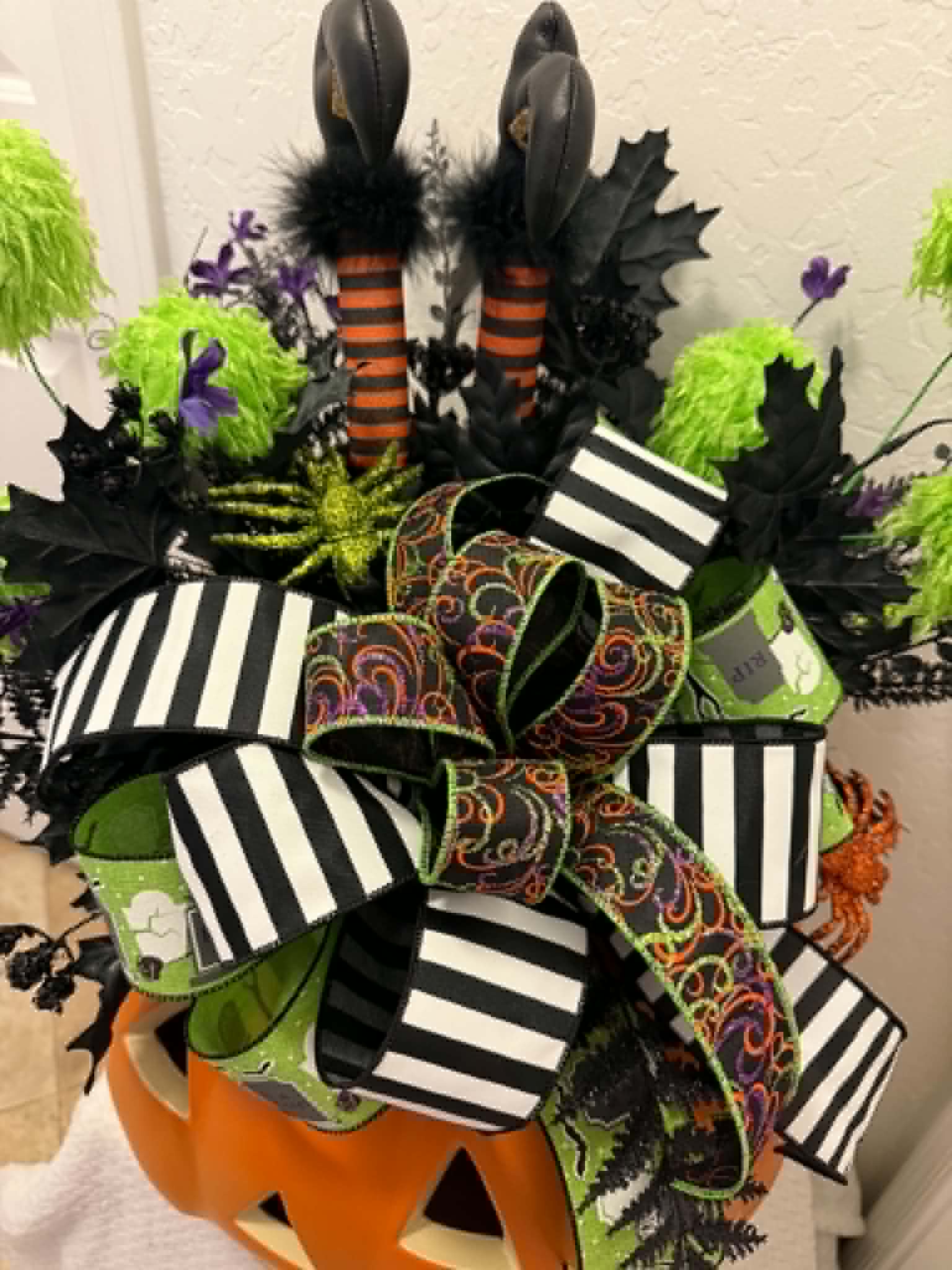 Halloween witch legs pumpkin centerpiece bow detail