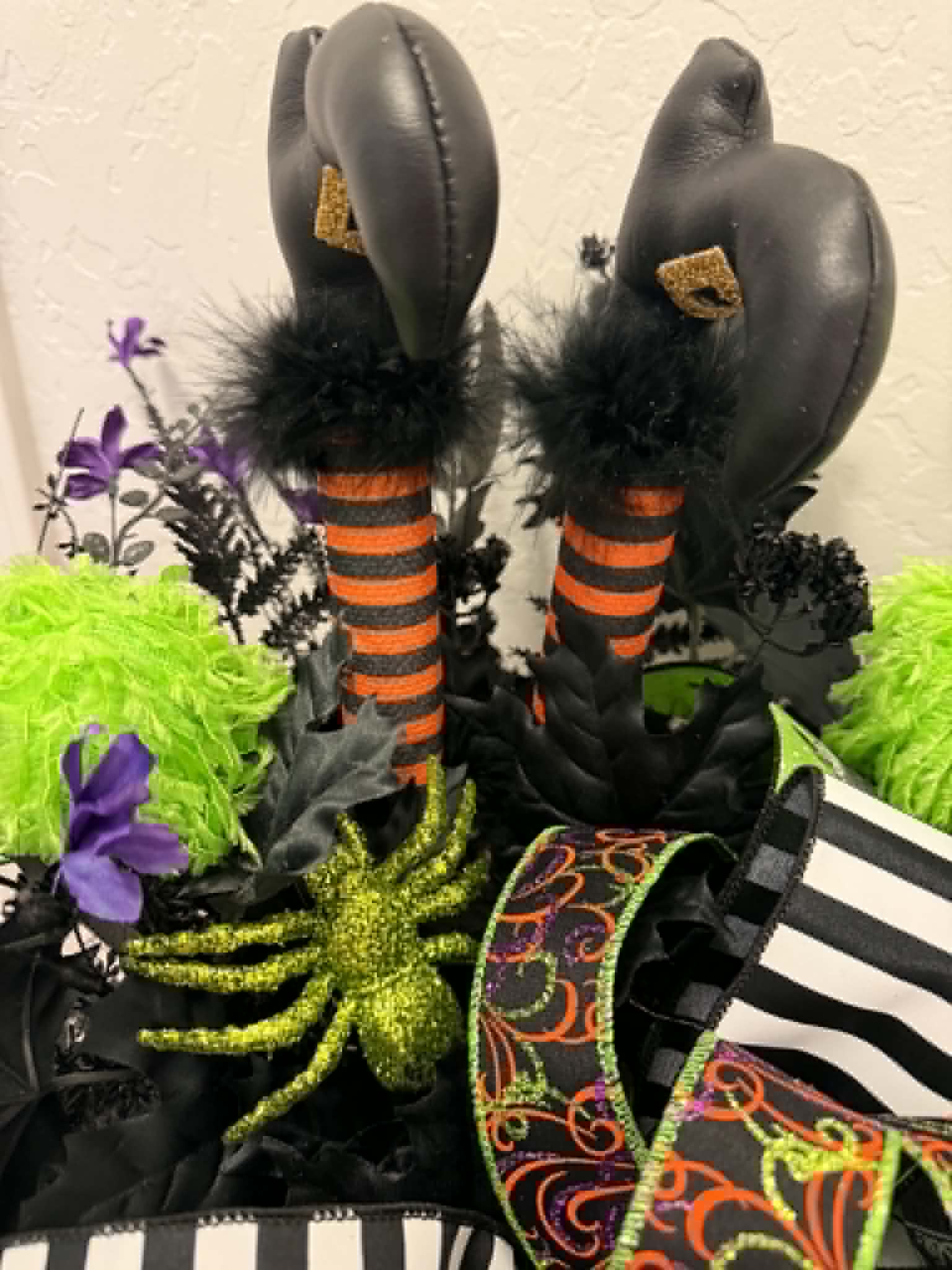 Halloween witch legs pumpkin centerpiece close-up of witch boots
