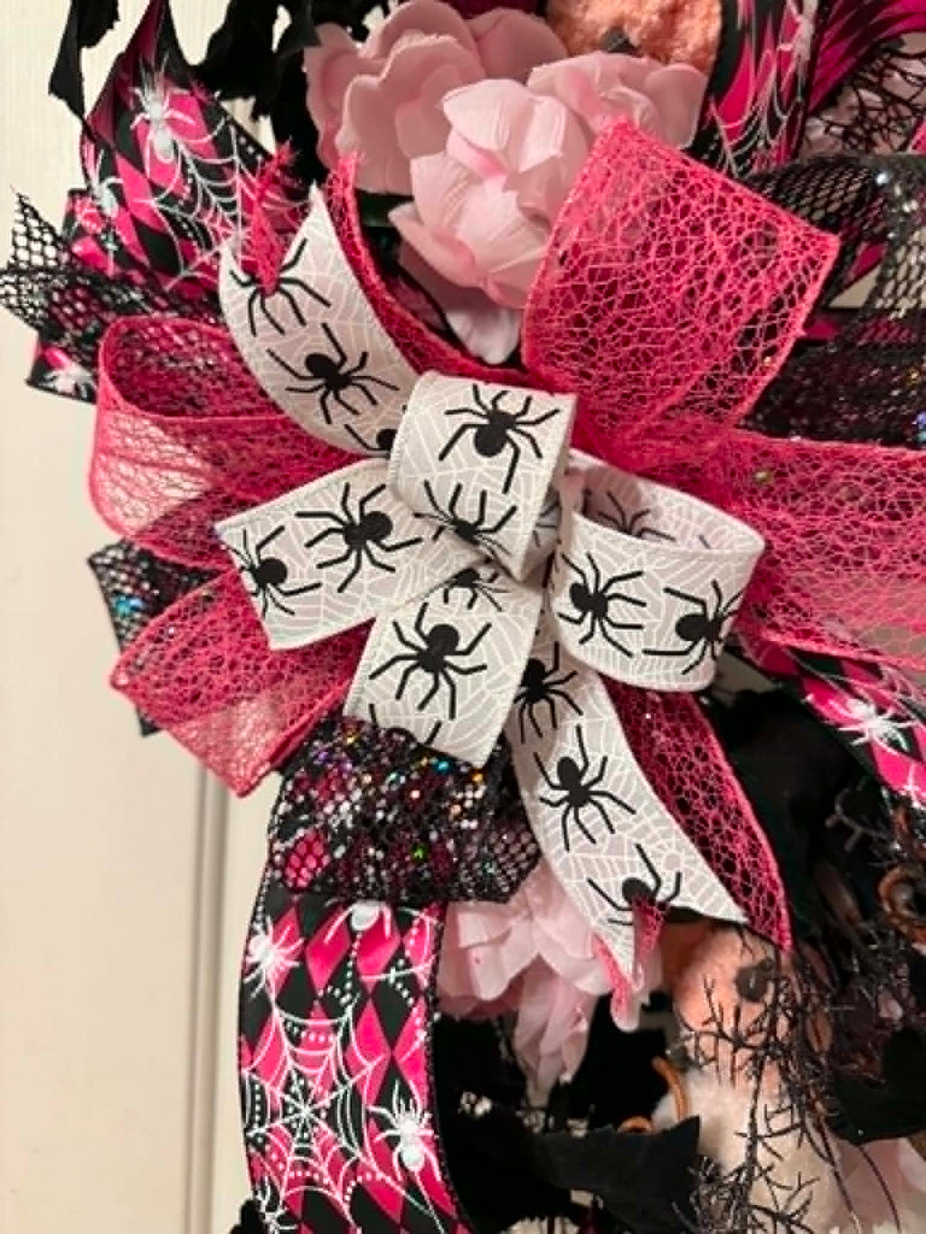 Pink and black spider Halloween wreath bow detail