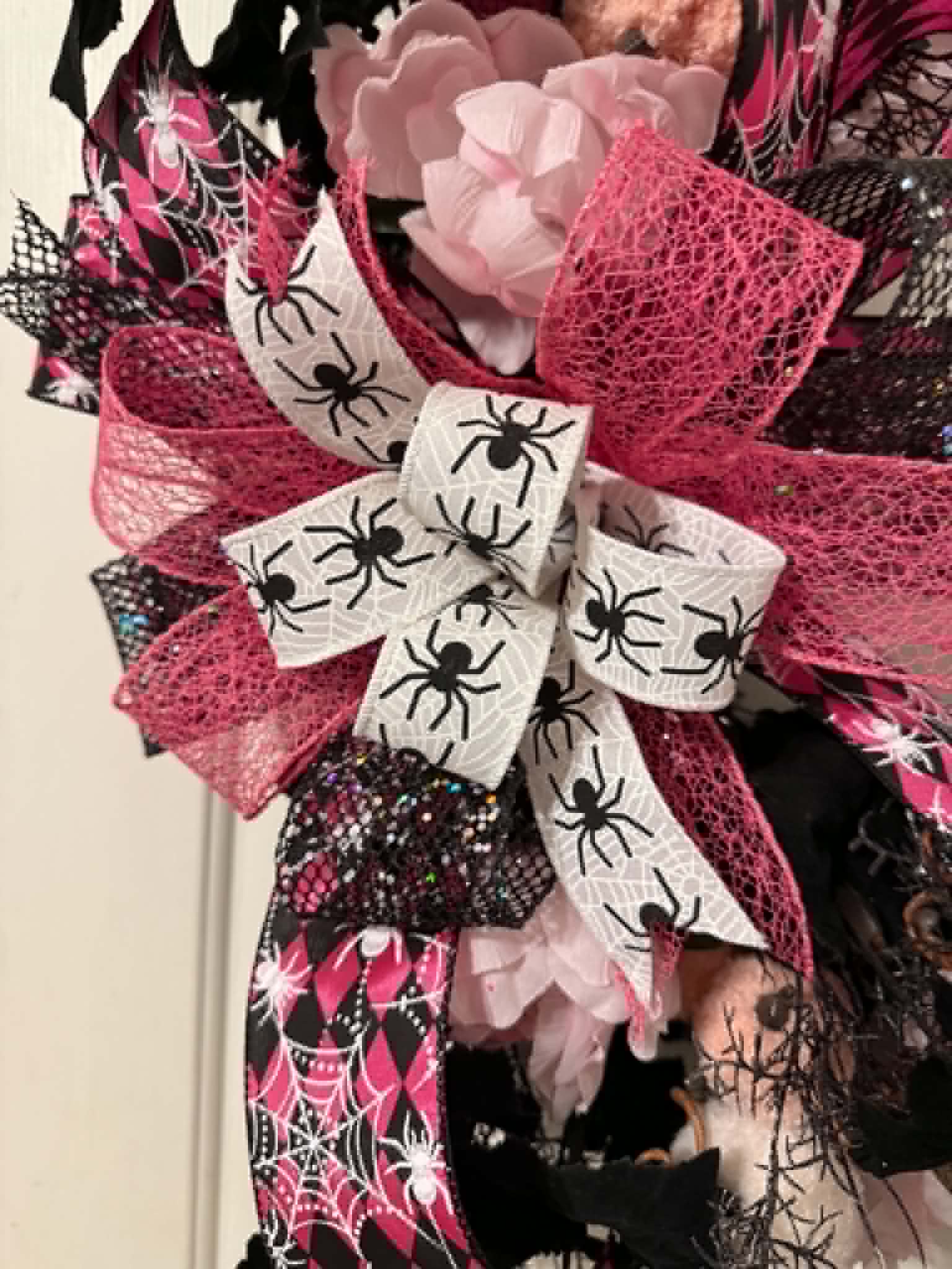 Pink and black spider Halloween wreath bow detail