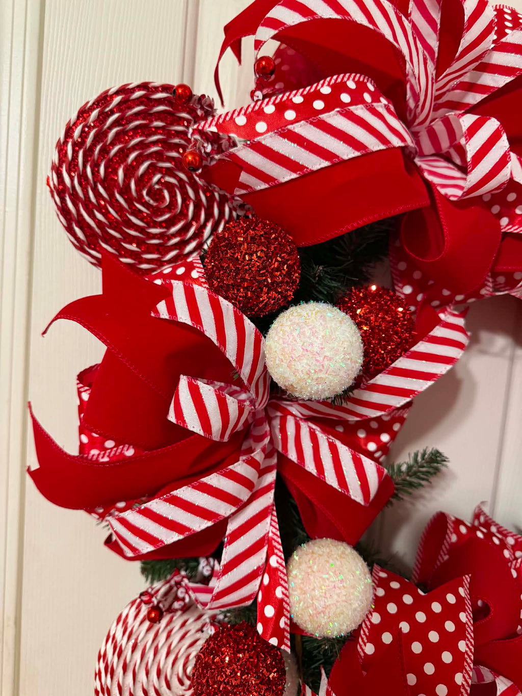 Candy Cane Christmas Wreath close-up - lollipop and glitter ball detail