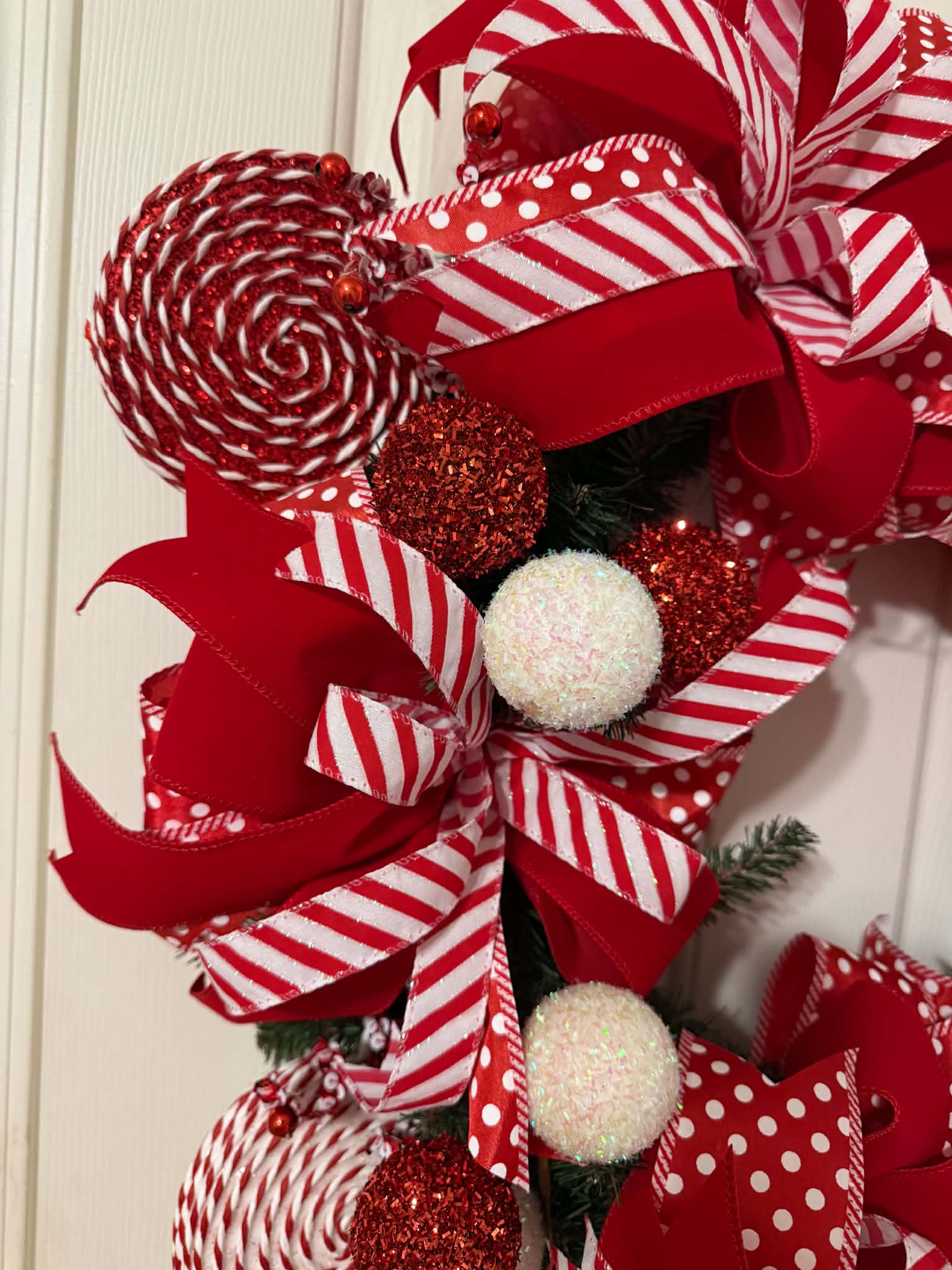 Candy Cane Christmas Wreath close-up - lollipop and glitter ball detail