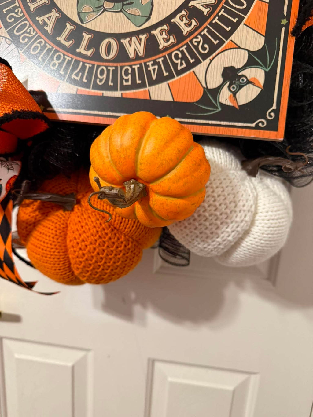 Halloween wreath pumpkin detail - orange knit and faux pumpkins
