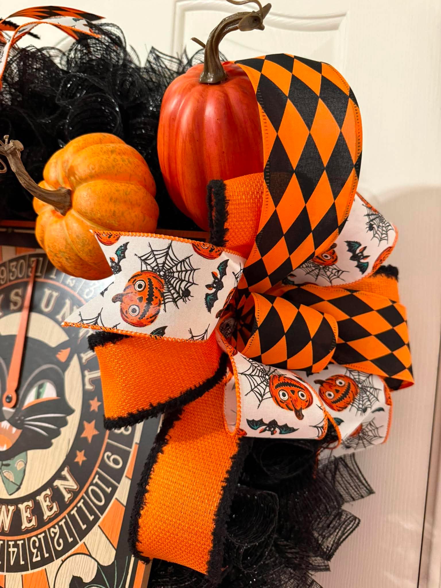 Halloween wreath side detail - pumpkins and ribbon bows