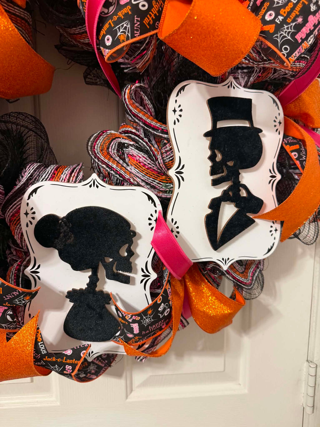 Skeleton couple Day of the Dead cameo plaques on Halloween wreath