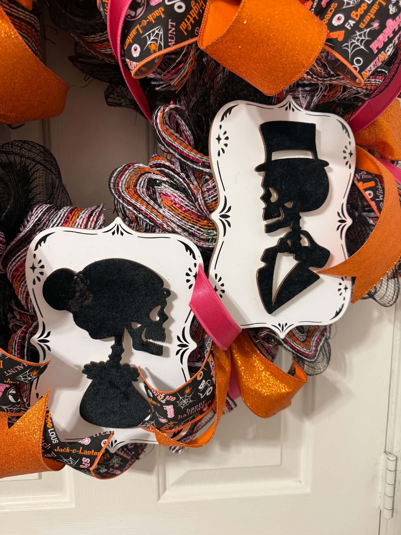 Skeleton couple Day of the Dead cameo plaques on Halloween wreath