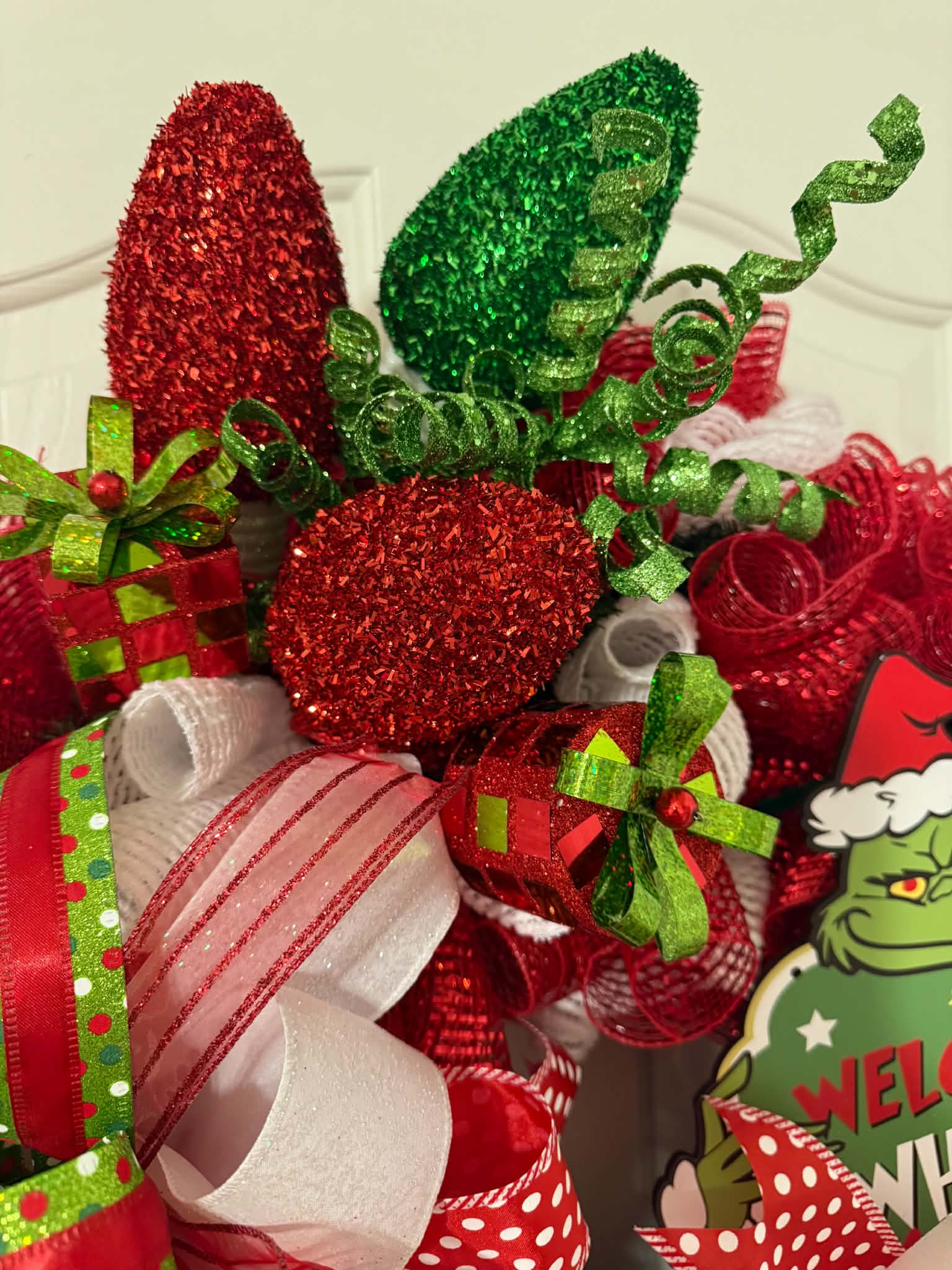 Grinch Welcome to Whoville Wreath - ornament and picks detail